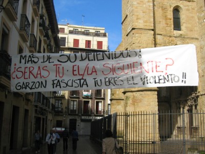 Translation: "More than 30 Detainees!  Are you next?  Garzon (big wig Spainsh judge) fascist, you are the violent!"